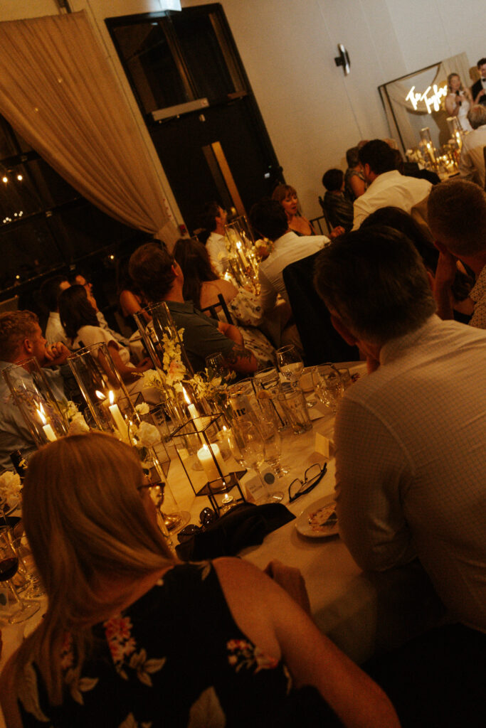 candid candle light reception photos of wedding guests