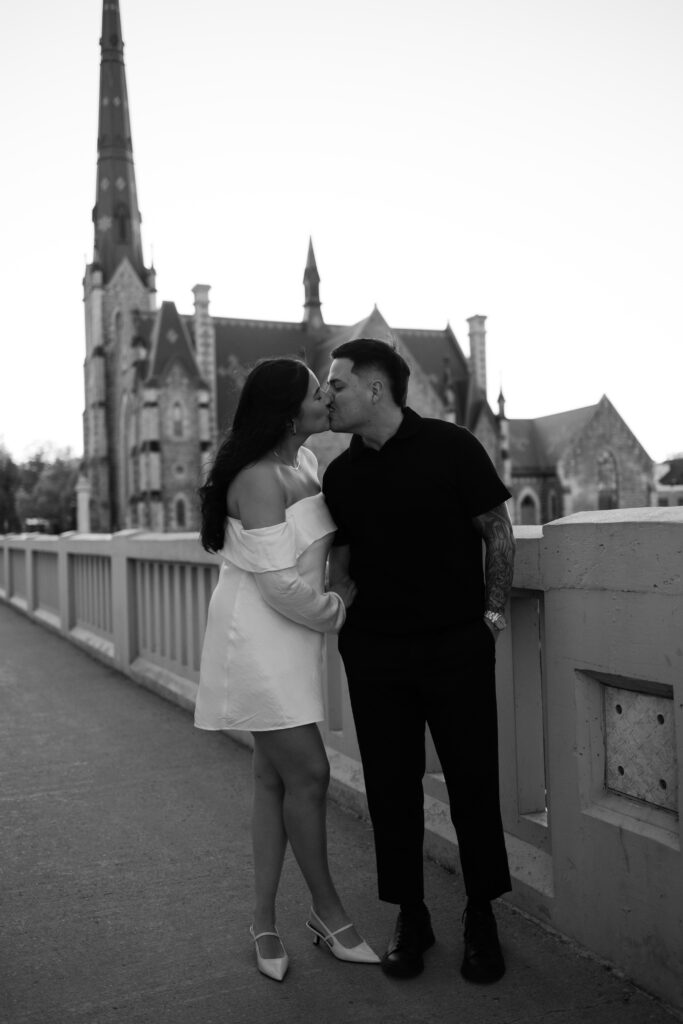 couples kissing for engagement photos in cambridge ontario taken by hematite images